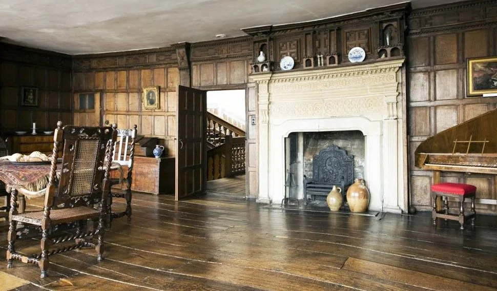 The oak-panelled chamber and ornate fireplace