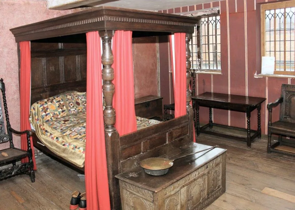 A historic bed chamber with a tester bed