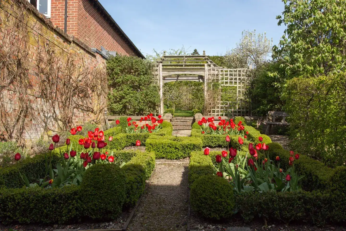 The completed formal garden in seasonal bloom