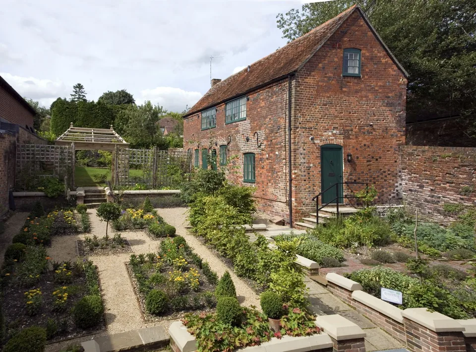 An elevated view over the formal garden paths and beds