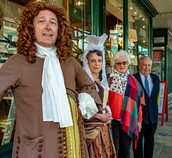 Costumed interpreters and supporters outside The Merchant’s House