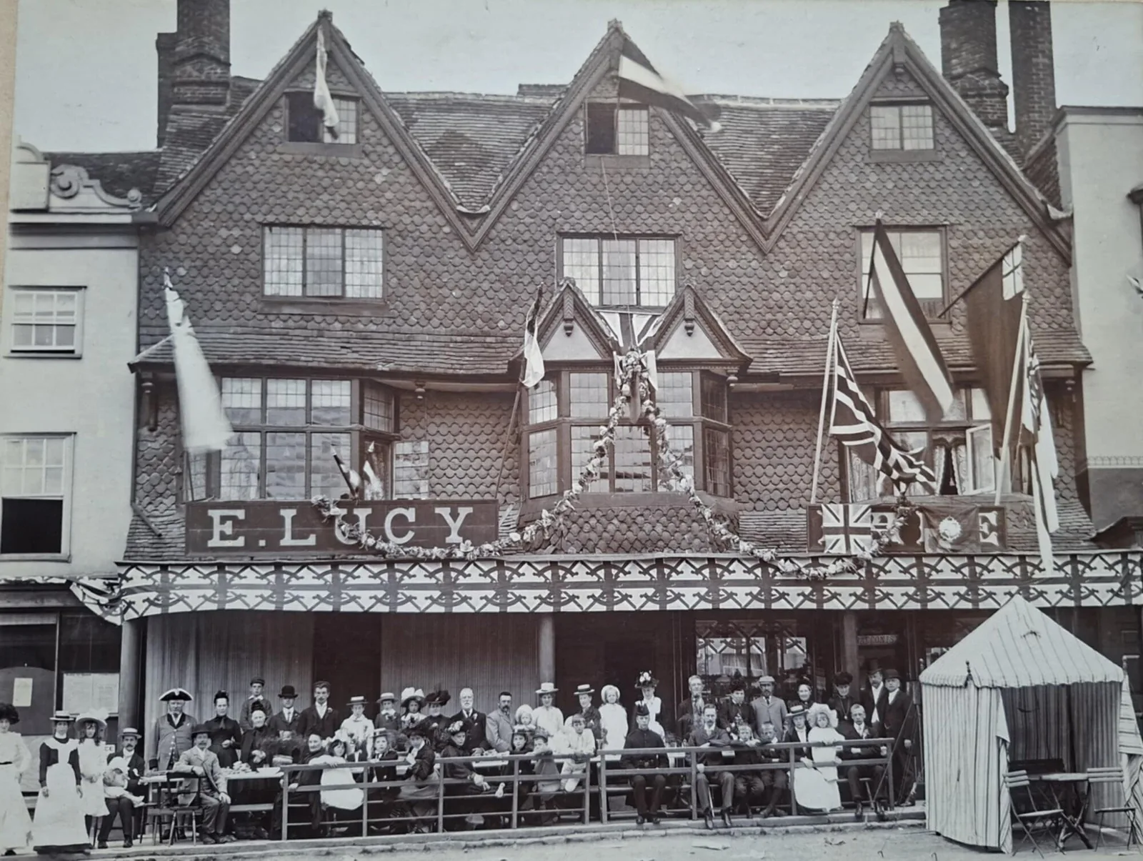 A historic photograph of a busy Marlborough shopfront