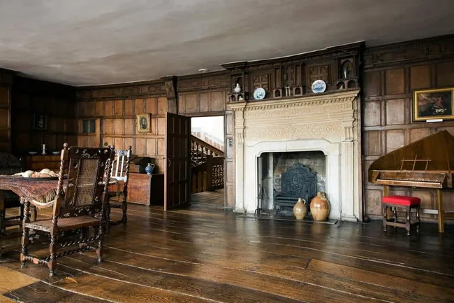 The oak-panelled chamber and ornate fireplace
